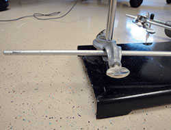 Rod on ring stand used to standardize heel drop