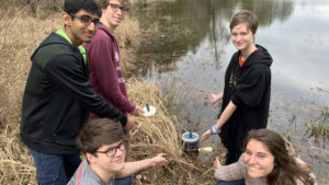 Students testing their container models in a nearby water source (photo courtesy of Hoover High School)